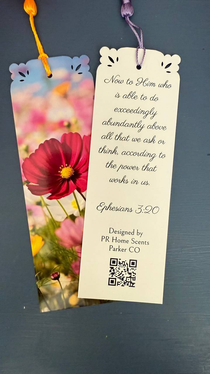 Handmade floral bookmark with tassel, featuring Ephesians 3:20 Bible verse on the back. Perfect for gifts and daily inspiration. 6"x2".