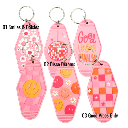 Double-sided pink retro keychain with smiley faces, daisies, and disco ball design – fun, aesthetic accessory for keys or bags.
