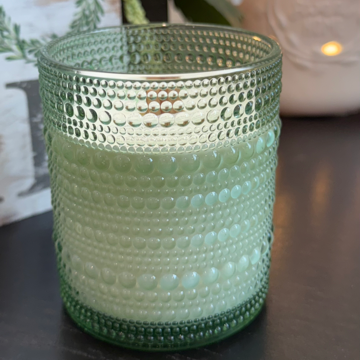 Morning Rain soy candle with green leaves, rose, lily, sandalwood, and ozone. Crackling wood wick, 40-50 hours burn time, phthalate-free.