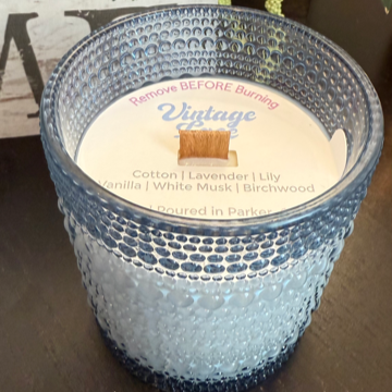 Vintage Lace soy candle with notes of cotton, lavender, lily, vanilla, musk, and birchwood. Clean, phthalate-free, reusable blue bubble jar.