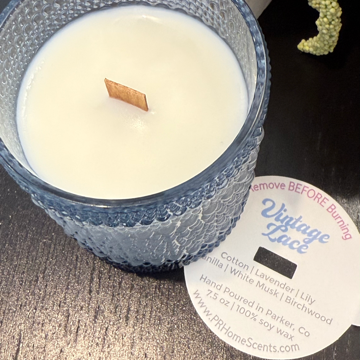 Vintage Lace soy candle with notes of cotton, lavender, lily, vanilla, musk, and birchwood. Clean, phthalate-free, reusable blue bubble jar.