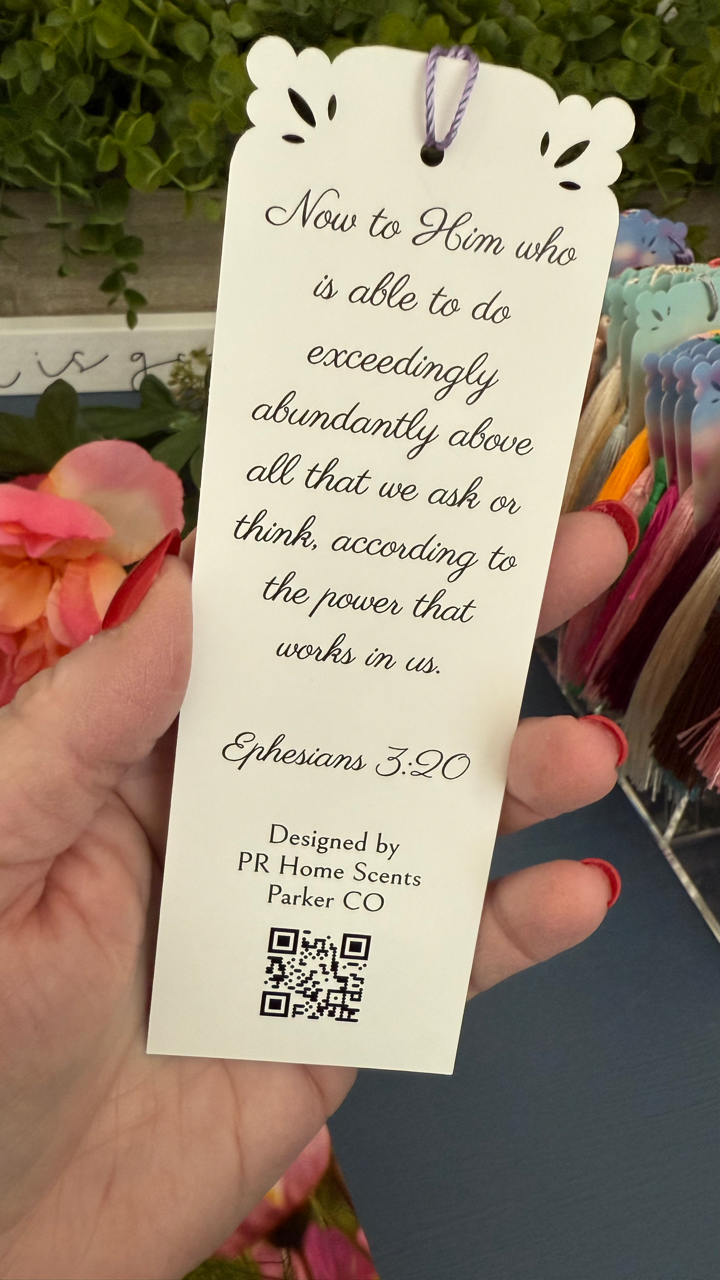 Handmade floral bookmark with tassel, featuring Ephesians 3:20 Bible verse on the back. Perfect for gifts and daily inspiration. 6"x2".