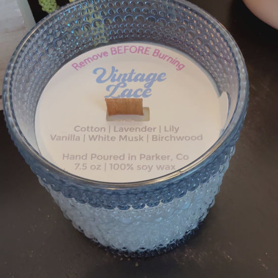 Vintage Lace soy candle with notes of cotton, lavender, lily, vanilla, musk, and birchwood. Clean, phthalate-free, reusable blue bubble jar.