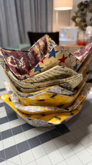 Hand-sewn bowl cozies made of 100% cotton, washable, and designed to protect hands from heat and cold. Fits most medium soup bowls.
